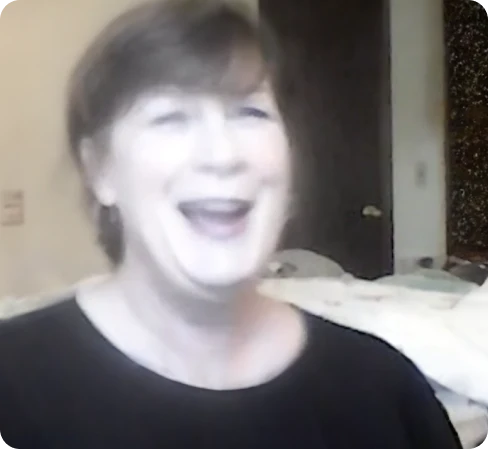 Smiling woman showing satisfaction with NerveCalm supplement.